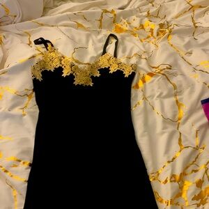 Black and fold detail dress size small  this dress is custom made  embroidered